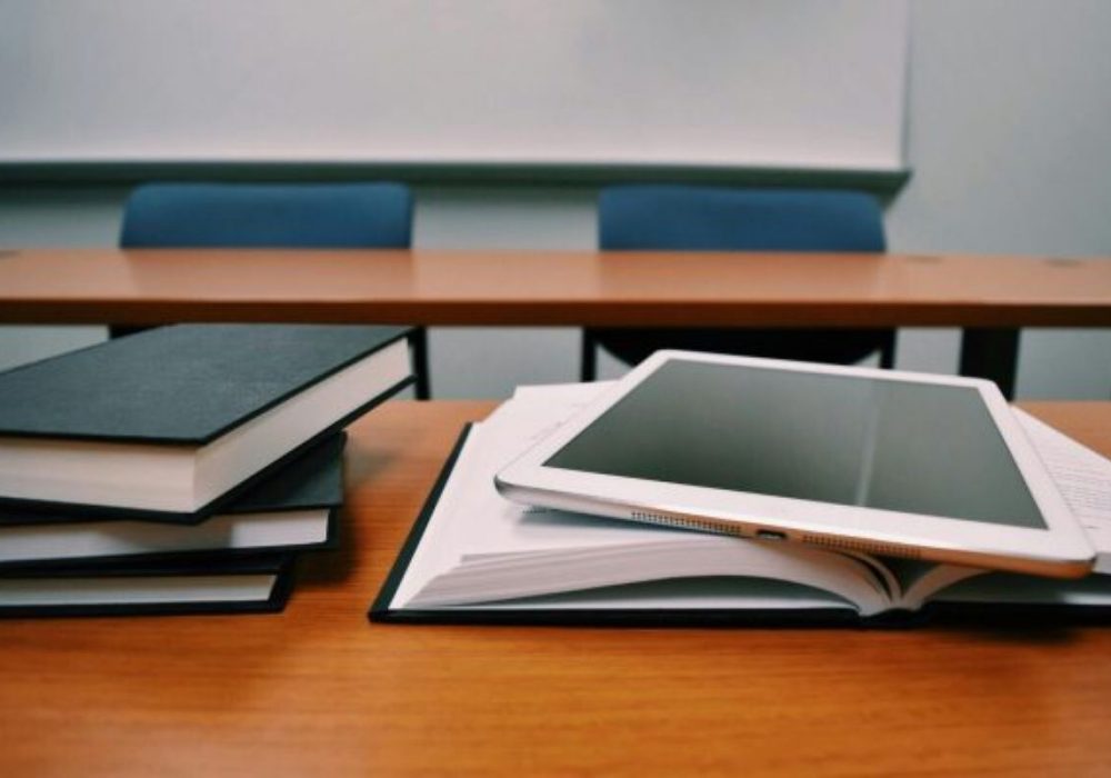 School desk with books representing school cleaning services by Stonebrook Cleaning Co